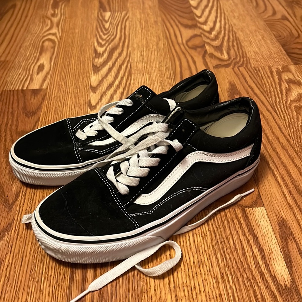 Lightly worn lace up low top black van sneakers. Womens size 7